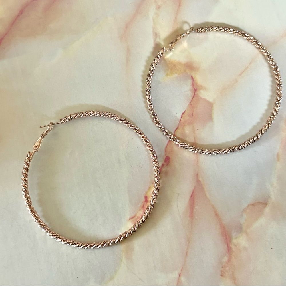 Large rose gold tone hoop earrings